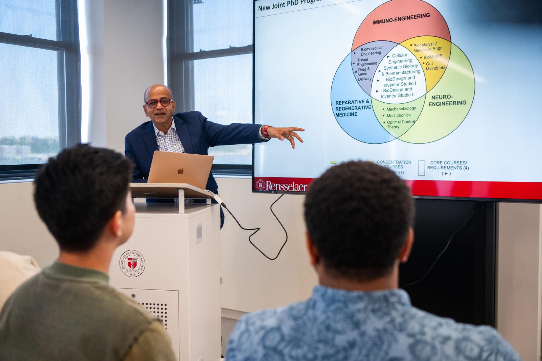 Center Director presenting a Venn diagram summarizing the proposed PhD program